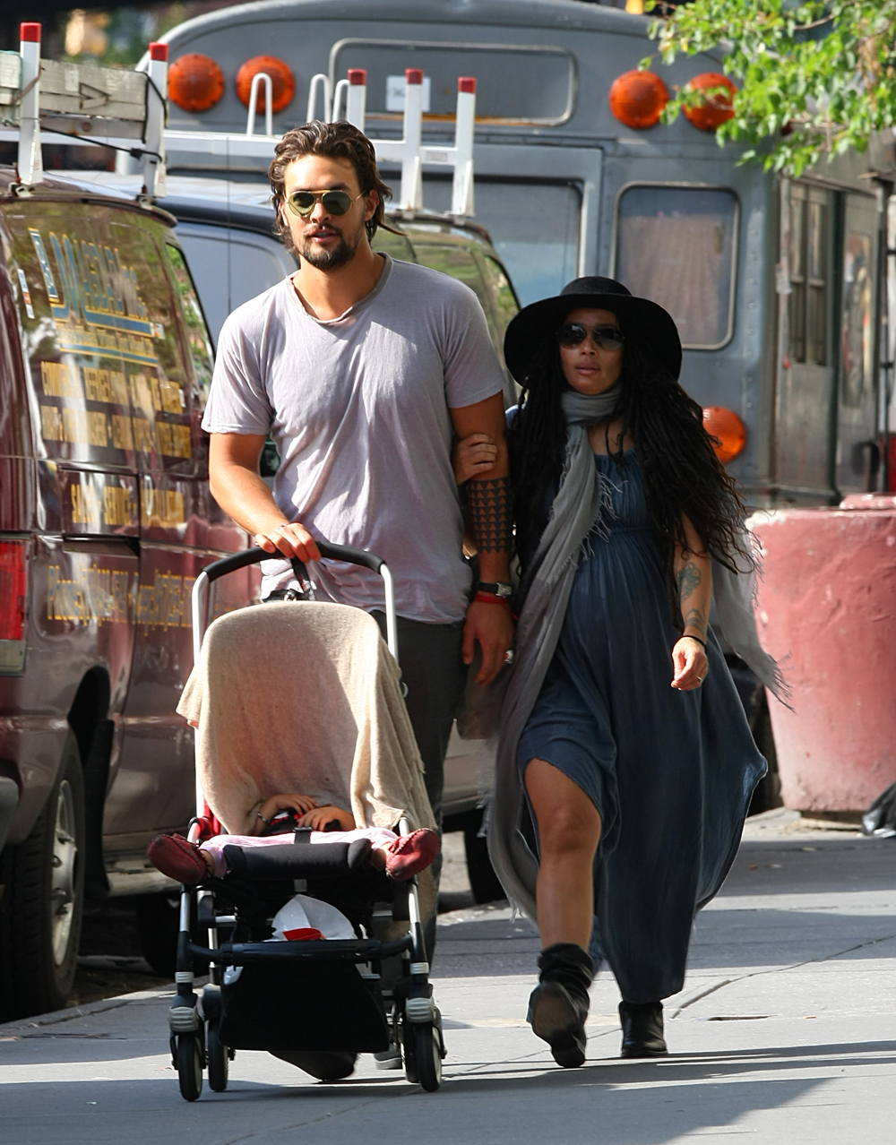 Lisa Bonet, husband Jason Momoa, and baby Lola Momoa shop for cl