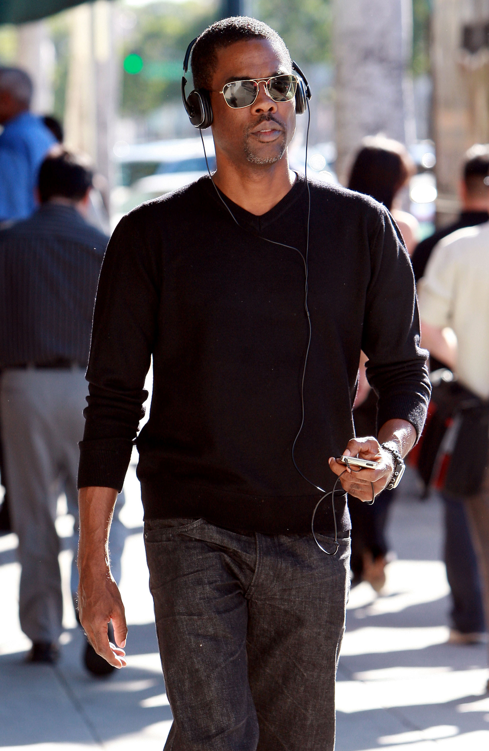 Chris Rock walking in Beverly Hills rehearsing with an iPod