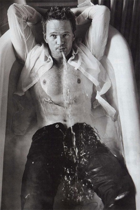 NPH taking a bath in his clothes