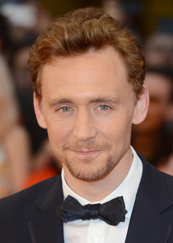 Tom Hiddleston even got into the action posing for photos with his ear to Tom Hiddleston even got into the action posing for photos with his ear to