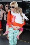 Rielle Hunter makes her way home with daughter Quinn after making the rounds in New York to promote her book "What Really Happened: John Edwards, Our Daughter and Me"