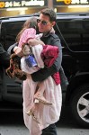 SLEEPY SURI - Tom Cruise carries his daughter Suri to the Chelsea Piers playground and back to their hotel in New York City