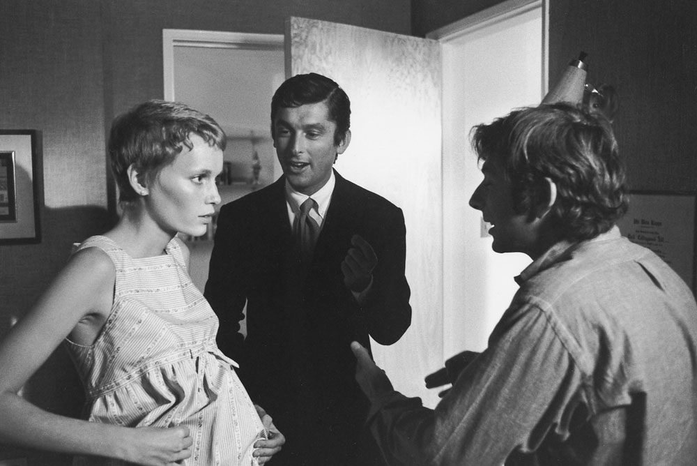 Left to right, Mia Farrow, Robert Evans, and Roman Polanski during production on ROSEMARY'S BABY, 1968. Digital Id: 1083_012484