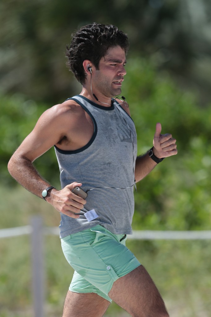 Adrian Grenier goes out for a rigorous jog on the beach in Miami