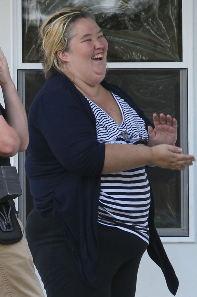 Mama June Shannon laughs and jokes with her security guard and a crew member from the family's hit TV show 'Here Comes Honey Boo Boo'