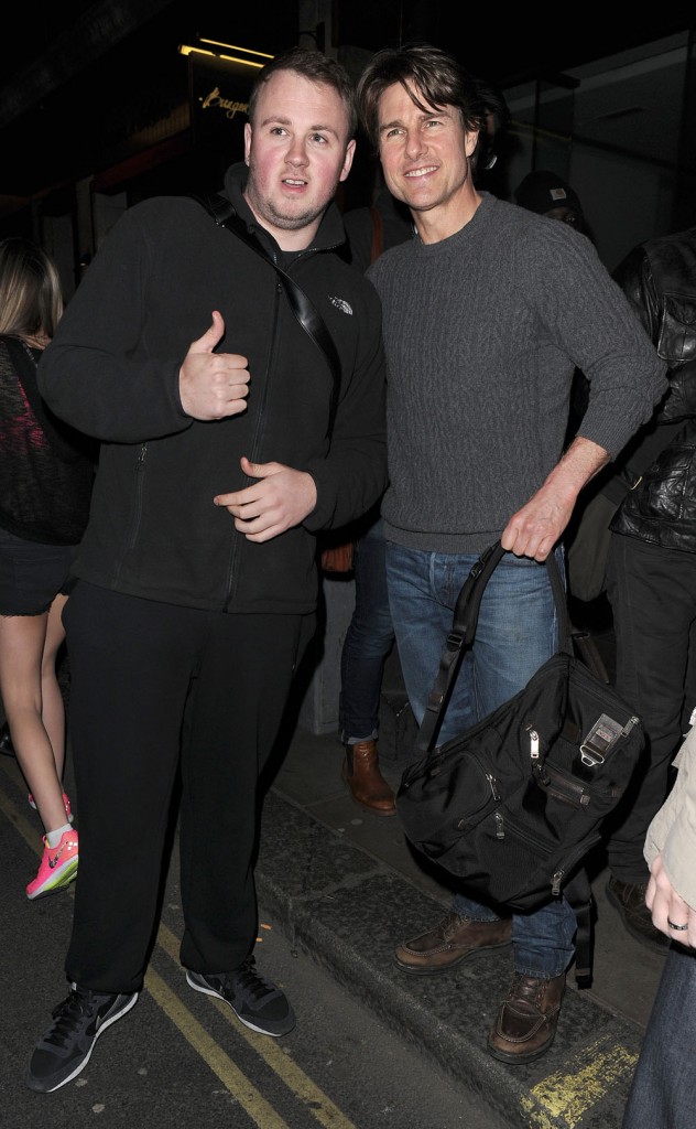 Tom Cruise out leaving a post production office in Soho. Tom took photos with many bystanders as he left, even photographers!