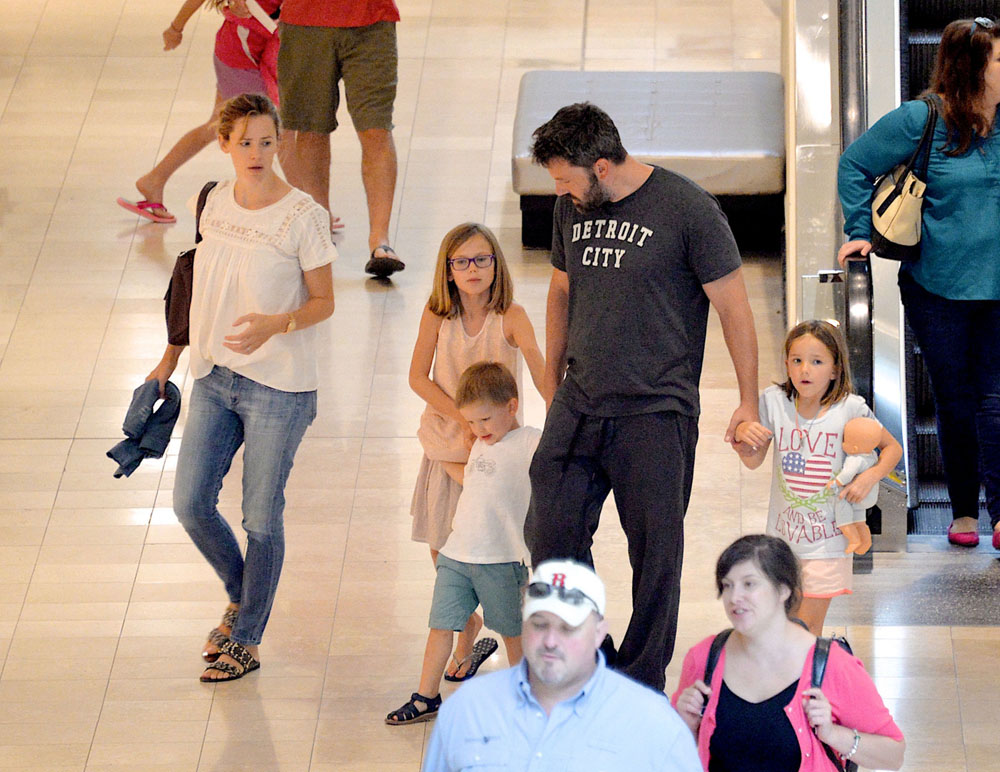 Ben Affleck and Jennifer Garner reunite as they step out in Atlanta with children Violet, Seraphina and Samuel - both wearing their wedding rings!
