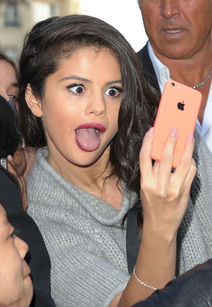 Selena Gomez Poses For Selfies With Her Fans While Visiting NRJ Radio Station