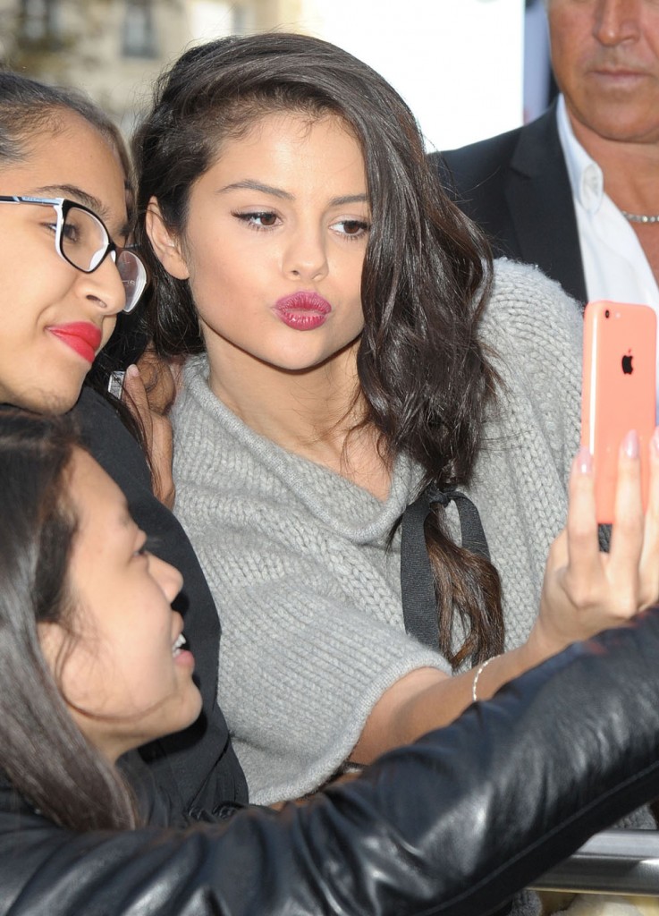 Selena Gomez Poses For Selfies With Her Fans While Visiting NRJ Radio Station