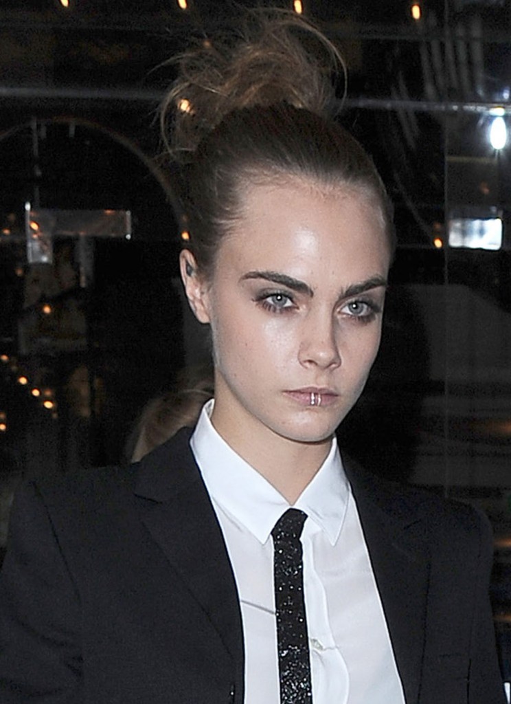 Cara Delevingne leaving her hotel wearing a rather eye catching lip ring