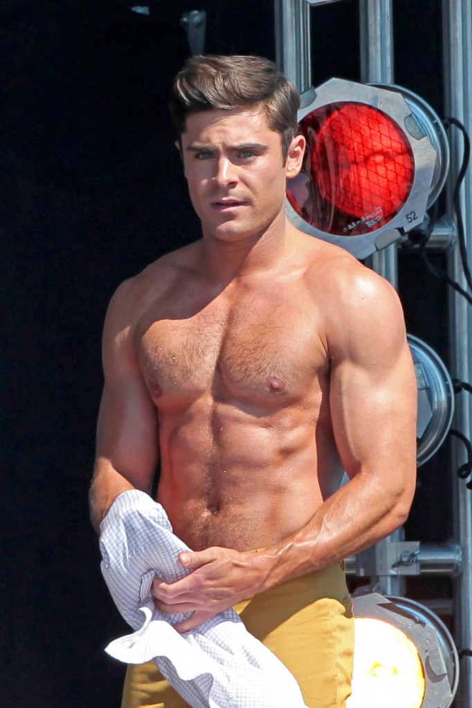 Zac Efron and Robert De Niro show off slightly different physiques as they both go shirtless while filming a scene for 'Dirty Grandpa'