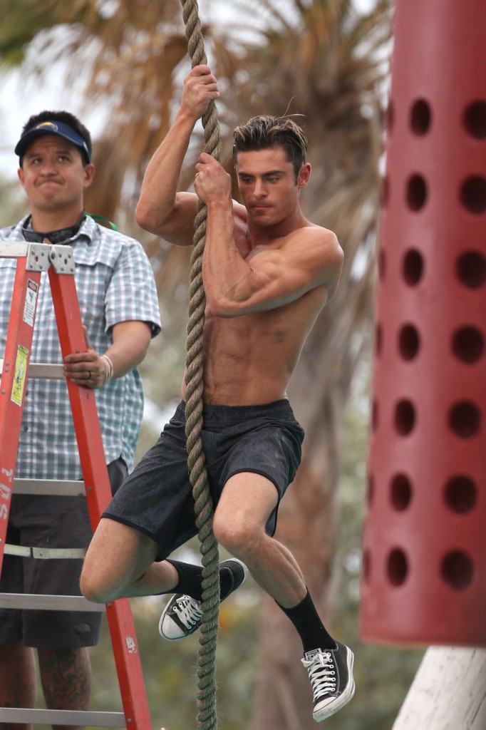 Zac Efron shows off his ripped body as he gets shirtless for 'Baywatch' in Miami