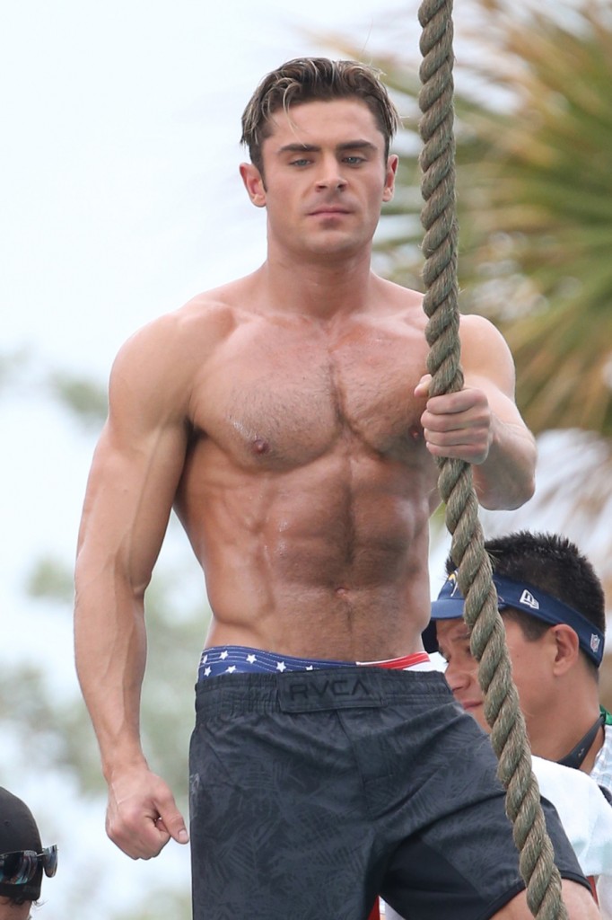 Zac Efron shows off his ripped body as he gets shirtless for 'Baywatch' in Miami