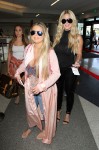 RHOA star Kim Zolciak spotted catching a flight out of LAX with her husband Kroy and kids Kroy Jr., Brielle, and Ariana