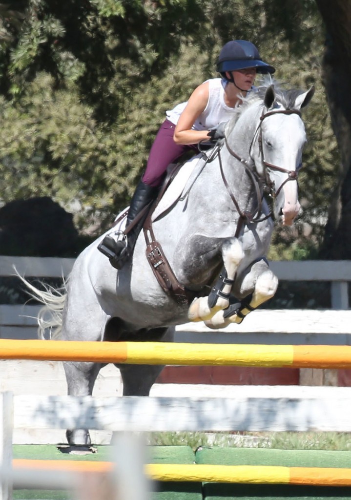 Kaley Cuoco shows some impressive horse riding skills while her boyfriend Karl Cook looks on