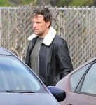 A tired looking Ben Affleck takes his children to church