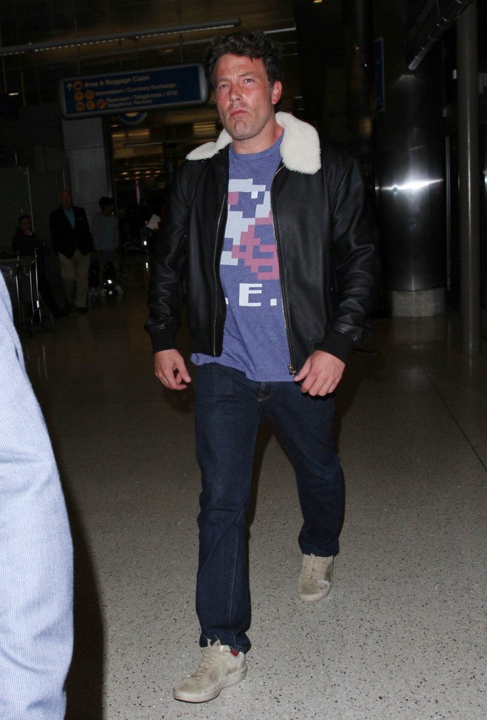 Ben Affleck goes for a classic look with a faux fur-collared leather flight jacket as he makes his way through LAX