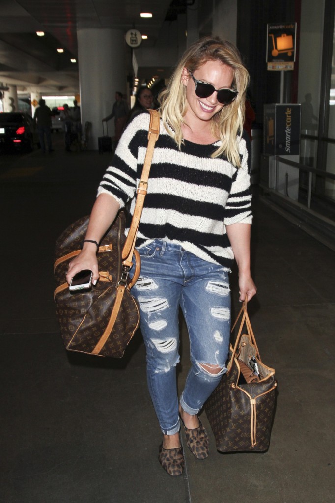 Stars in Stripes! Hilary Duff arrives into LAX airport in some bold stripes and ripped jeans