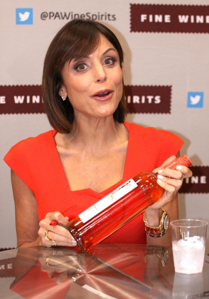 Bethenny Frankel signs bottles of her Skinny Girl line at a wine and spirits store in Philadelphia, United States