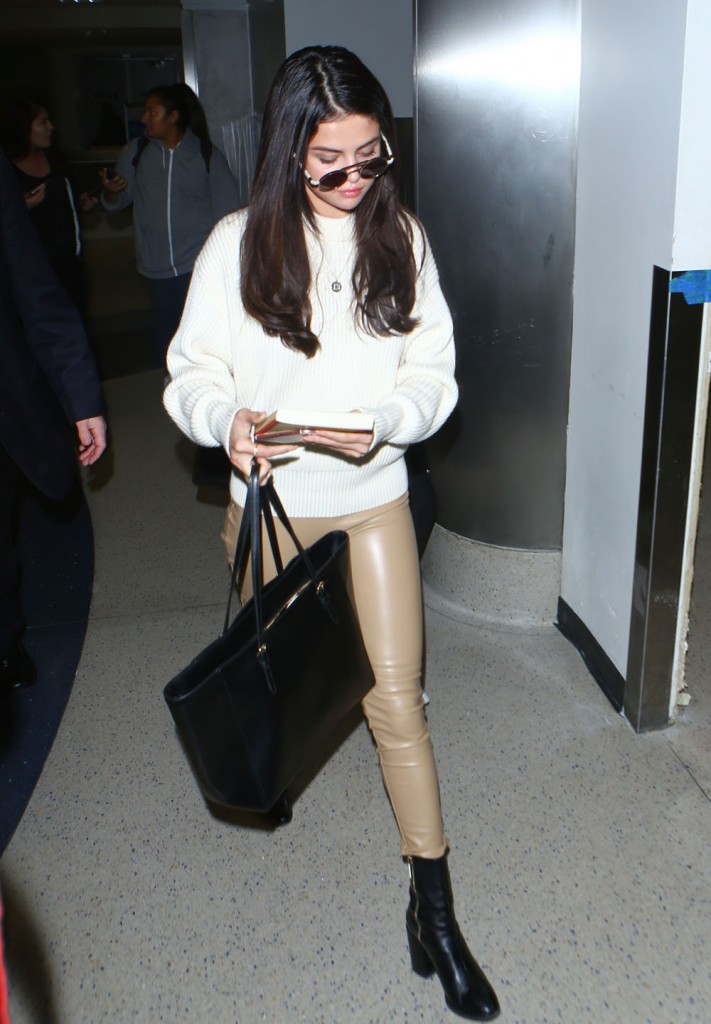 Selena Gomez Arriving On A Flight At LAX