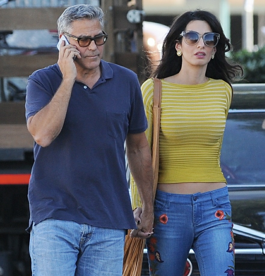 George Clooney and his wife Amal Alamuddin take their hound dog for a walk on the set of 'Suburbicon'