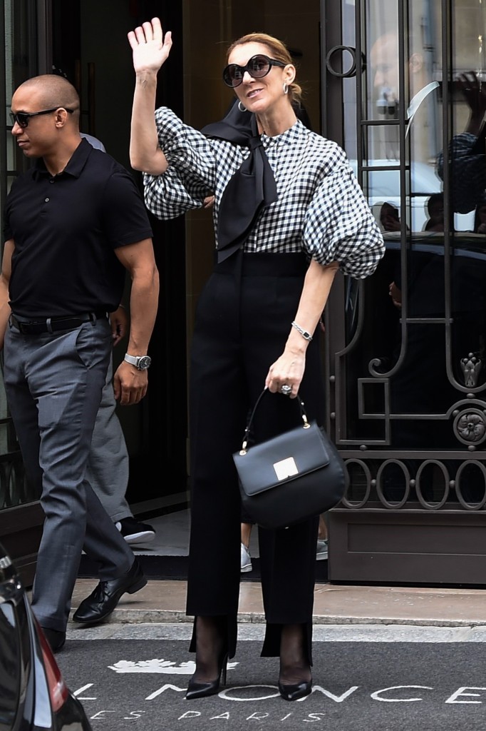 Celine Dion exits hotel in a chic look