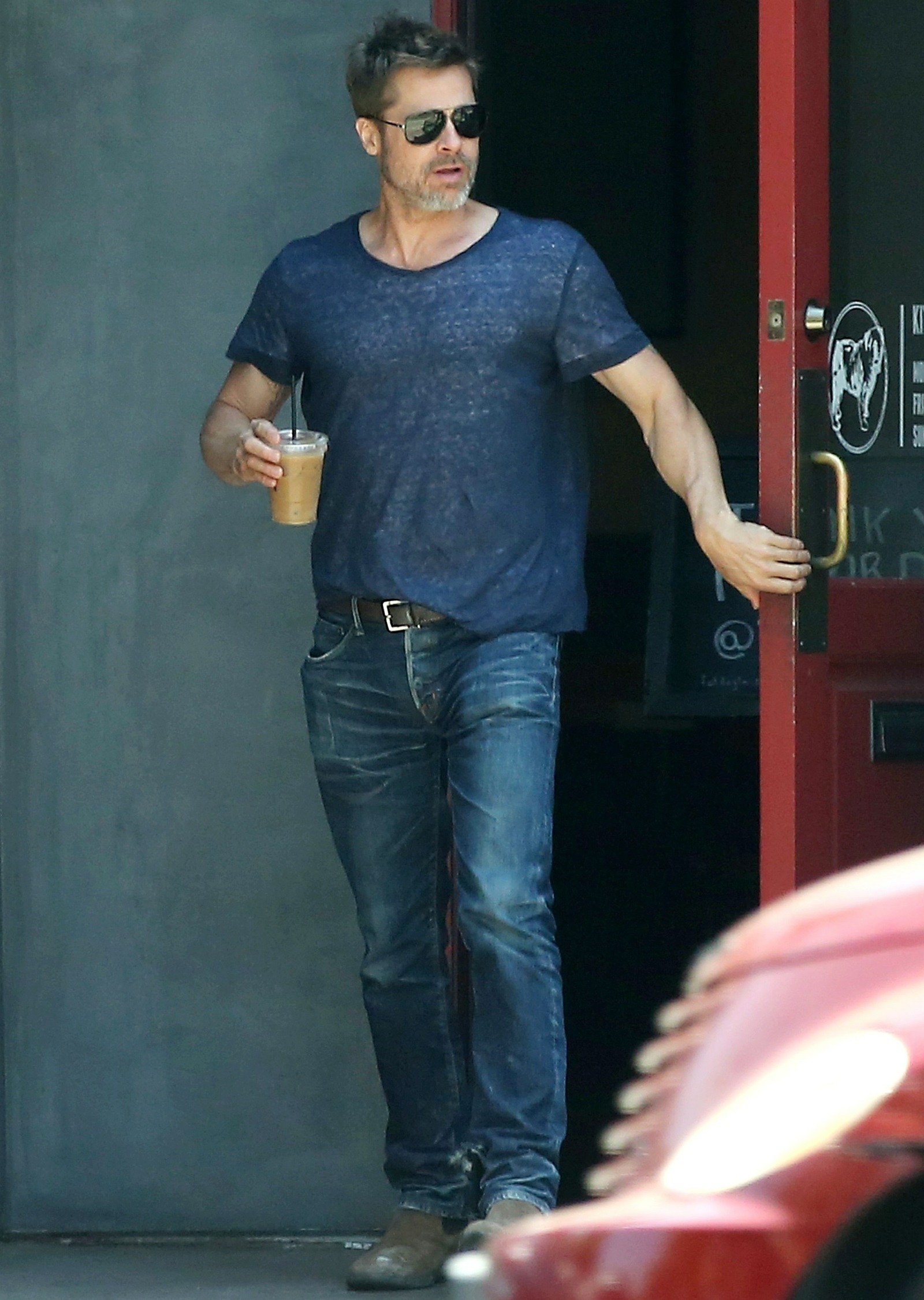 Brad Pitt takes home a iced coffee after lunch