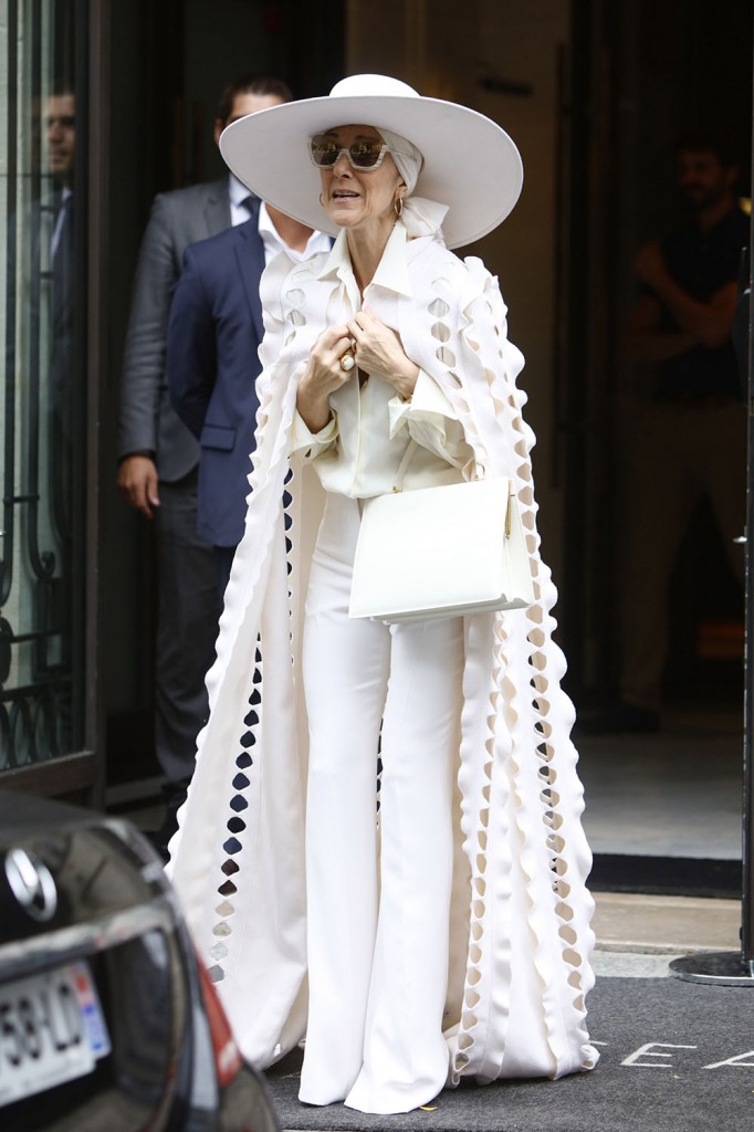 Celine Dion dressed in all white leaves her hotel in Paris