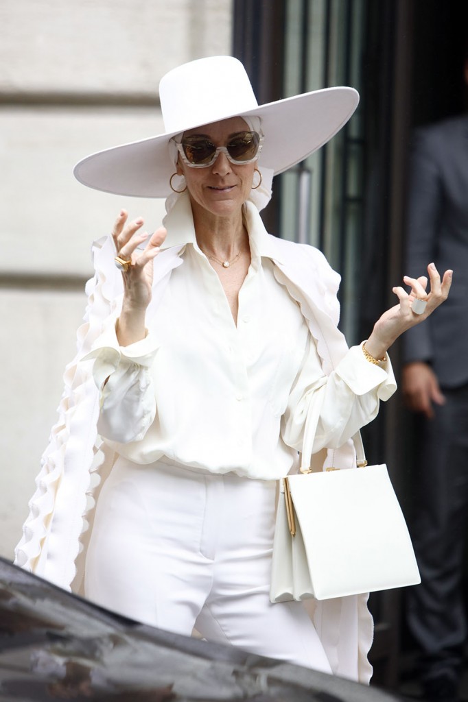 Celine Dion dressed in all white leaves her hotel in Paris