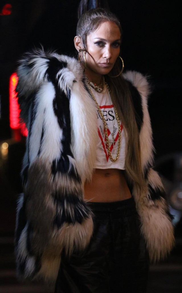 Jennifer Lopez teams a chinchilla coat with boxing-inspired shoes, shorts and crop top while filming her latest music video 'Amor' in the early hours of Friday morning in Manhattan's Soho neighbourhood