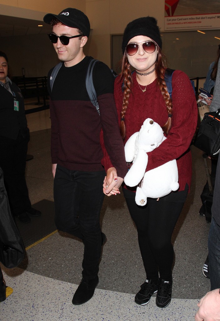 Meghan Trainor arrives at LAX with her boyfriend