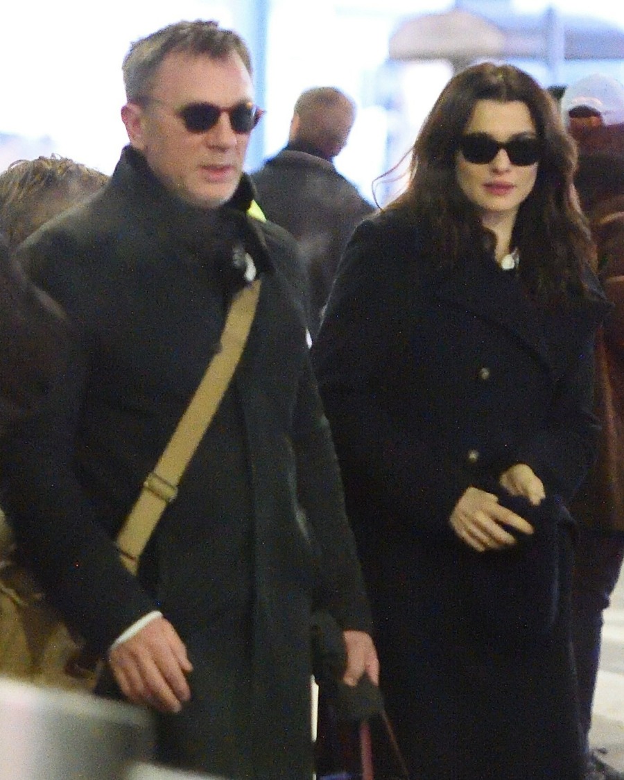 Daniel Craig and Rachel Weisz with her son Henry arrive at JFK airport