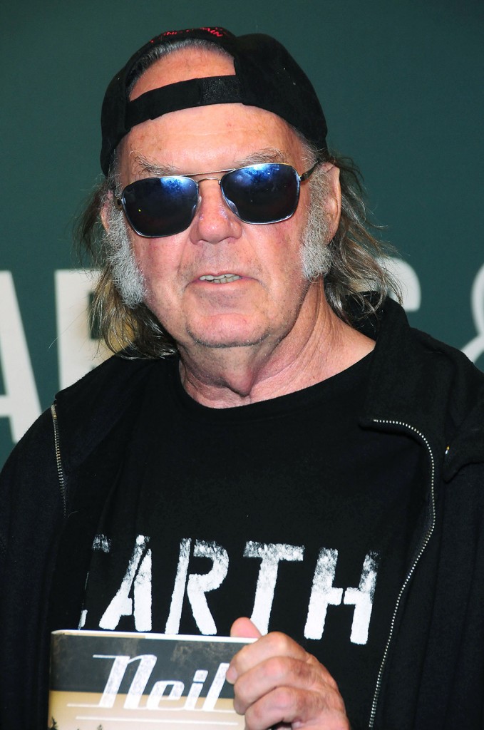 Neil Young signs copies of his book 'Special Deluxe: A Memoir of Life & Cars'