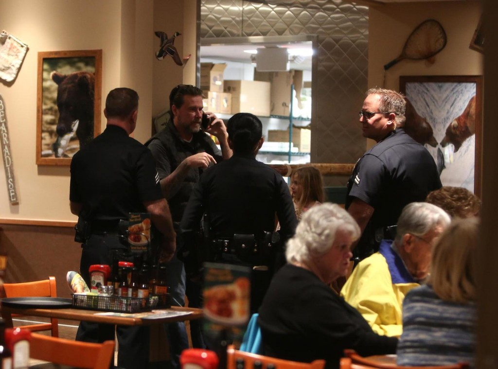 Tori Spelling and Dean McDermott are escorted out of Tarzana's Black Bear Diner by the LAPD after cops were called for a disturbance between the couple as they had dinner with their kids