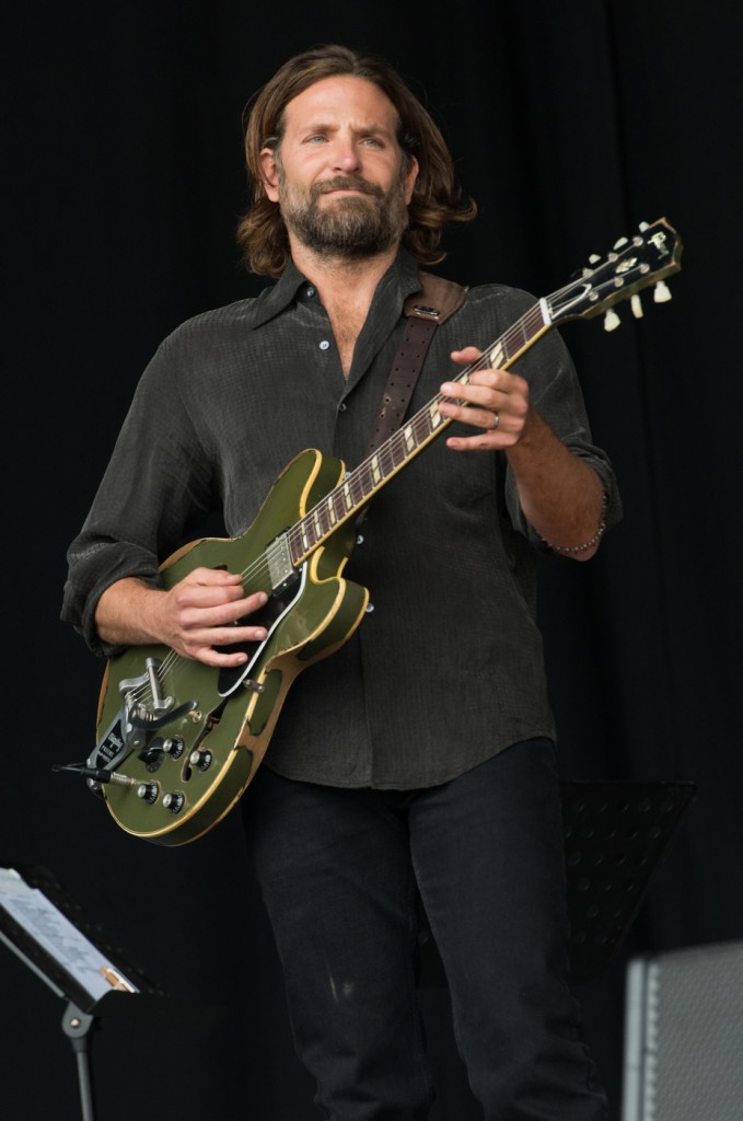 Bradley Cooper makes a surprise appearance on the Pyramid stage to shoot scenes for his film A Star Is Born at Glastonbury Festival