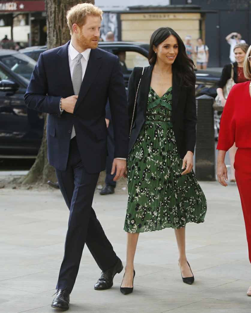 Britain's Prince Harry and Meghan Markle arrive to attend a reception hosted by Malcolm Turnbull, Prime Minister of Australia, right, and his wife Lucy Turnbull, second right, at Australia House in London celebrating the forthcoming Invictus Games Sydney 2