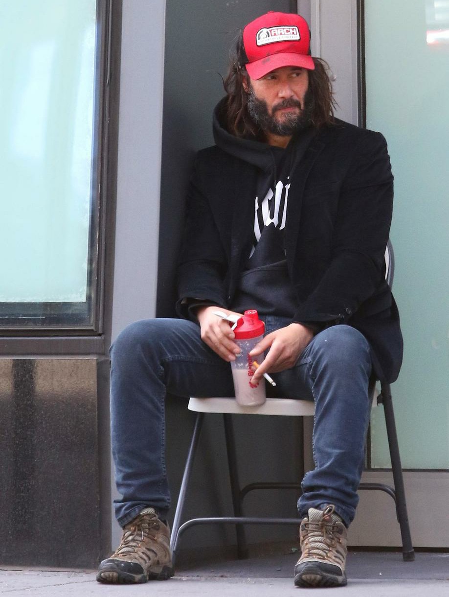 Keanu Reeves has a homeless look while sporting long messy hair and thick beard in NYC