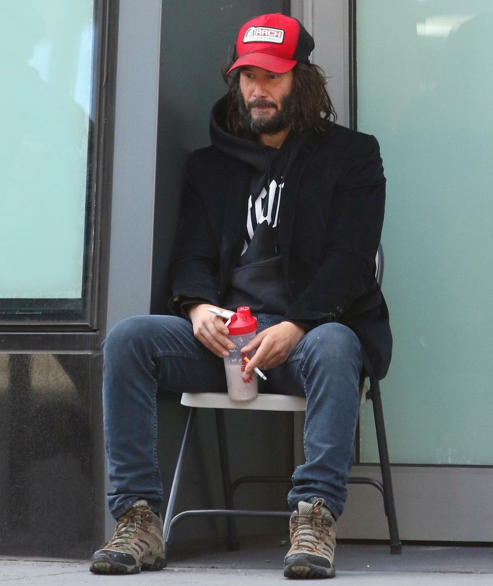 Keanu Reeves has a homeless look while sporting long messy hair and thick beard in NYC