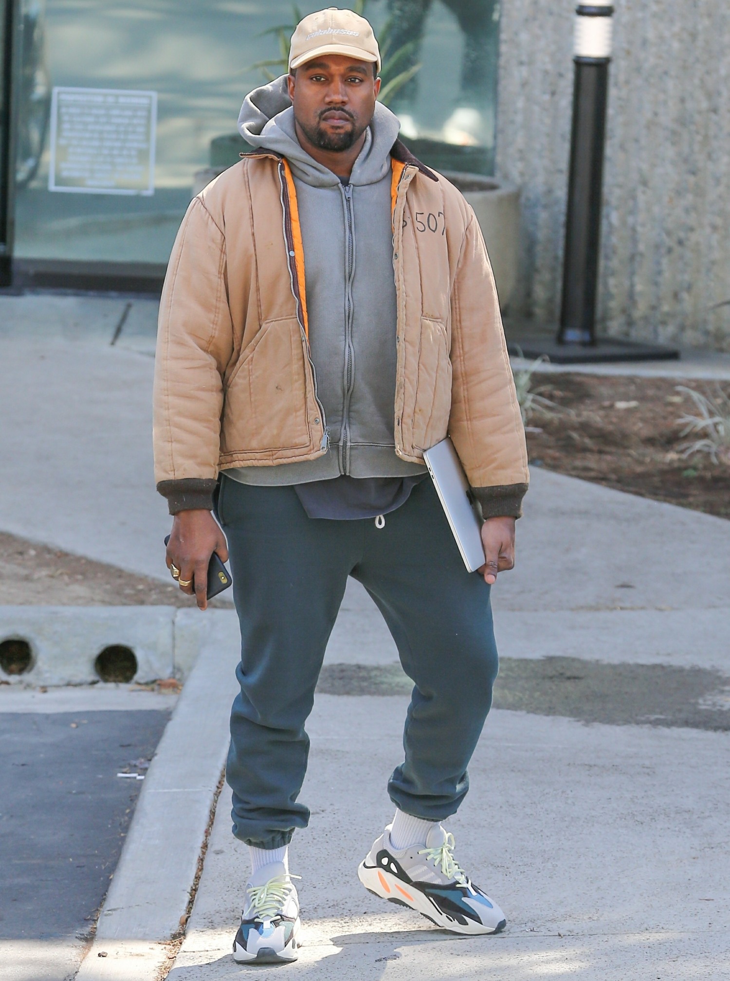Kanye West greets our shutterbugs with open arms!
