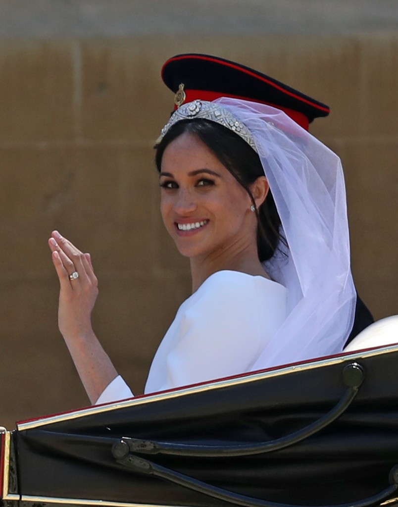 Meghan Markle and Prince Harry ride in an Ascot Landau carriage through Windsor after their wedding