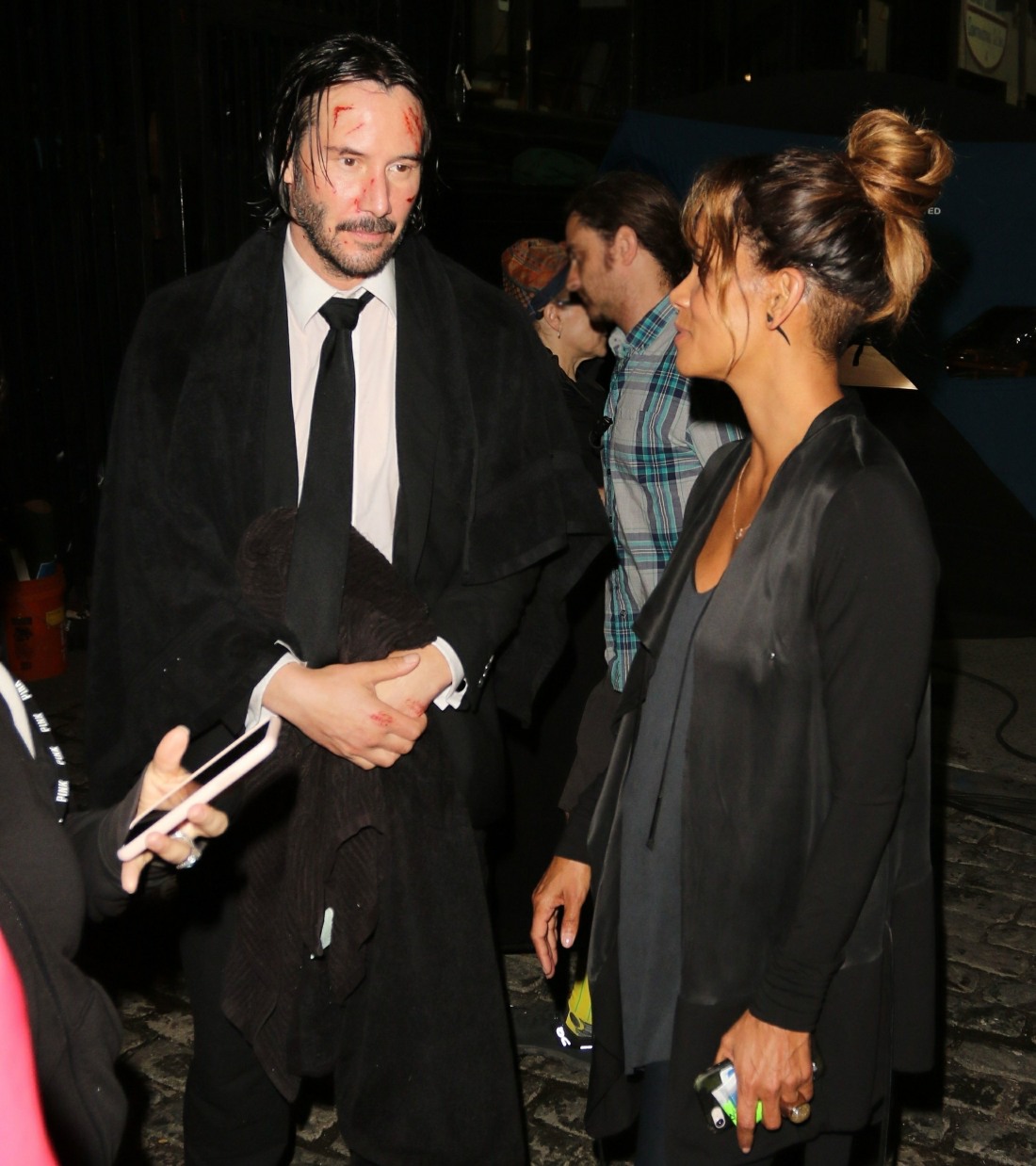 Halle Berry chats with Keanu Reeves on set of 'John Wick 3' during a late night of filming
