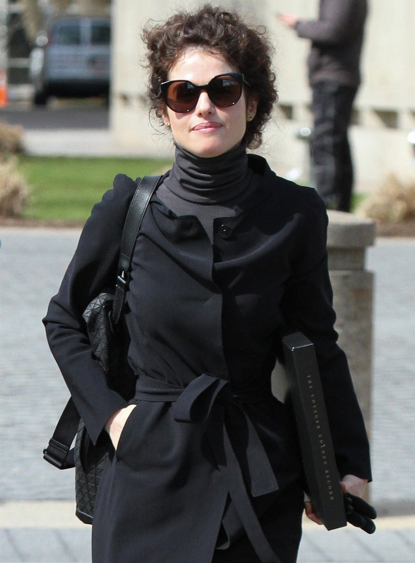 Neri Oxman rocks all black and carries "The Voyager Record'' while heading to class at MIT