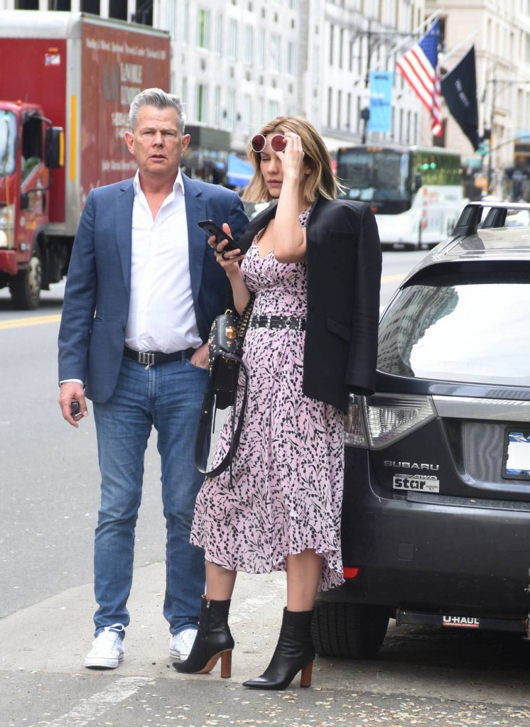 Katharine McPhee and David Foster wait for a ride on Central Park South