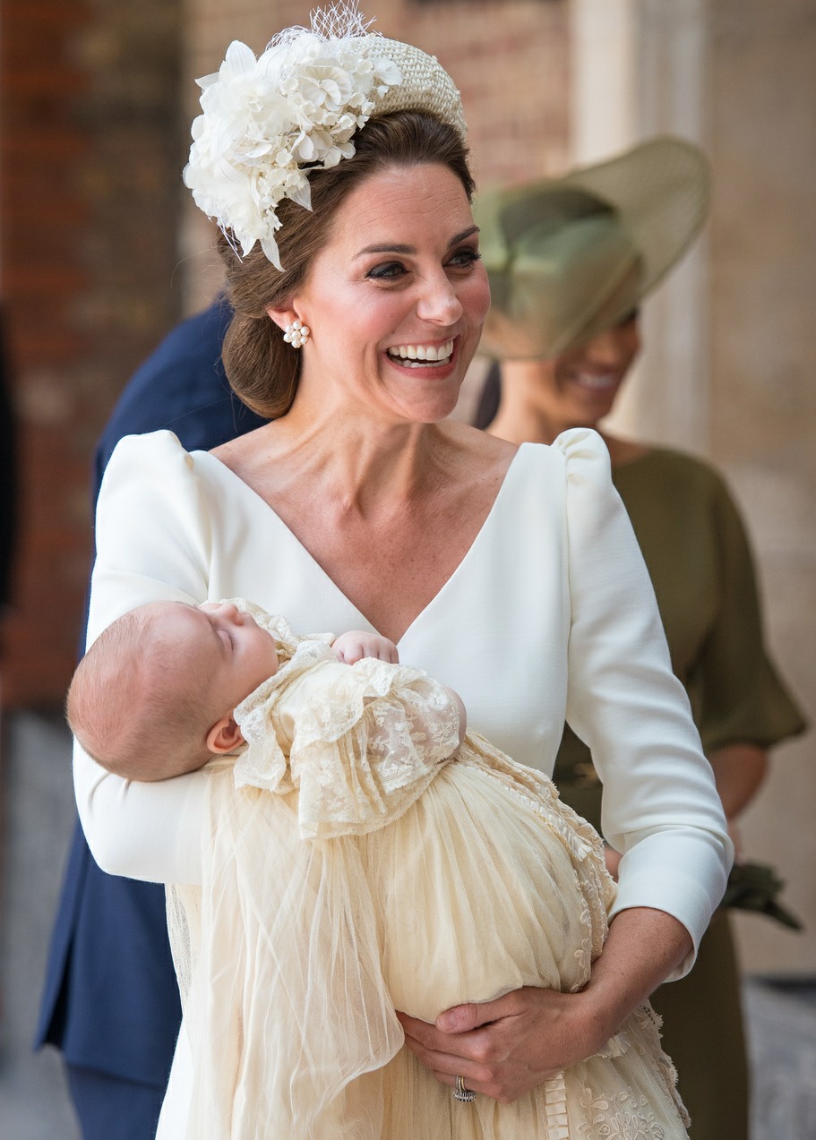 The Duchess of Cambridge carries Prince Louis as they arrive for his christening service at the Chapel Royal, St James's Palace, London