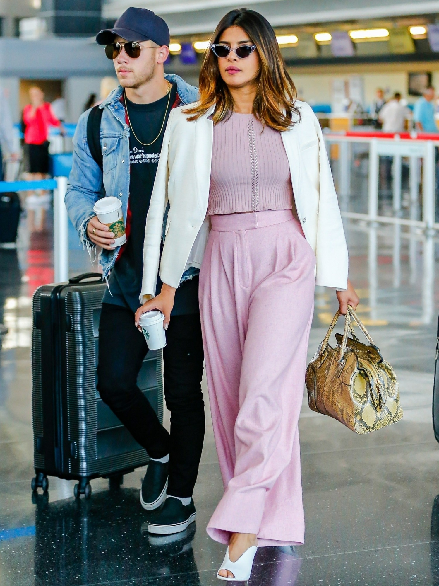 Priyanka Chopra and Nick Jonas make their relationship official arriving at JFK together