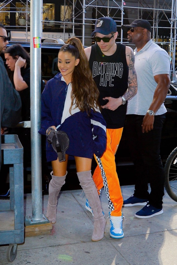 Ariana Grande and Pete Davidson smile for the camera