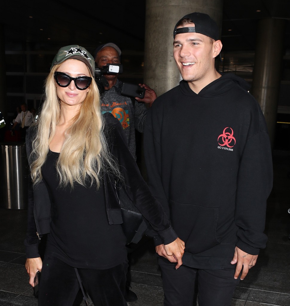 Paris Hilton and her fiance Chris Zylka arrive at Los Angeles International (LAX) Airport