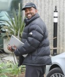 Happy Daddy Kanye West heads to work after baby number 3