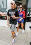 Hailey Baldwin and Justin Bieber hold hands while waiting for their coffee