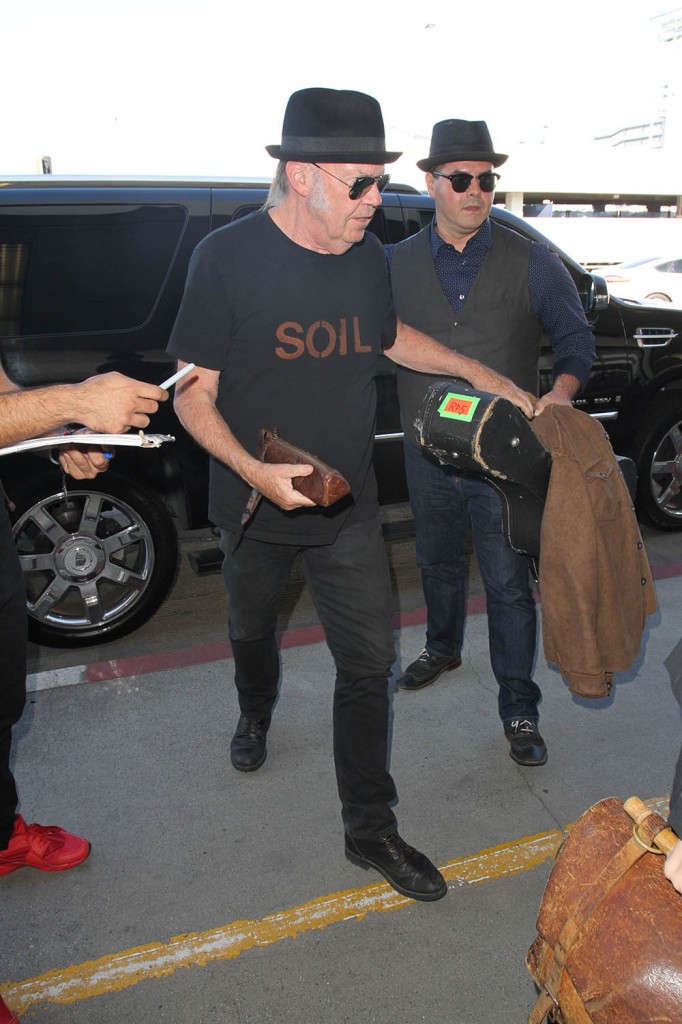 Daryl Hannah and Neil Young depart from LAX